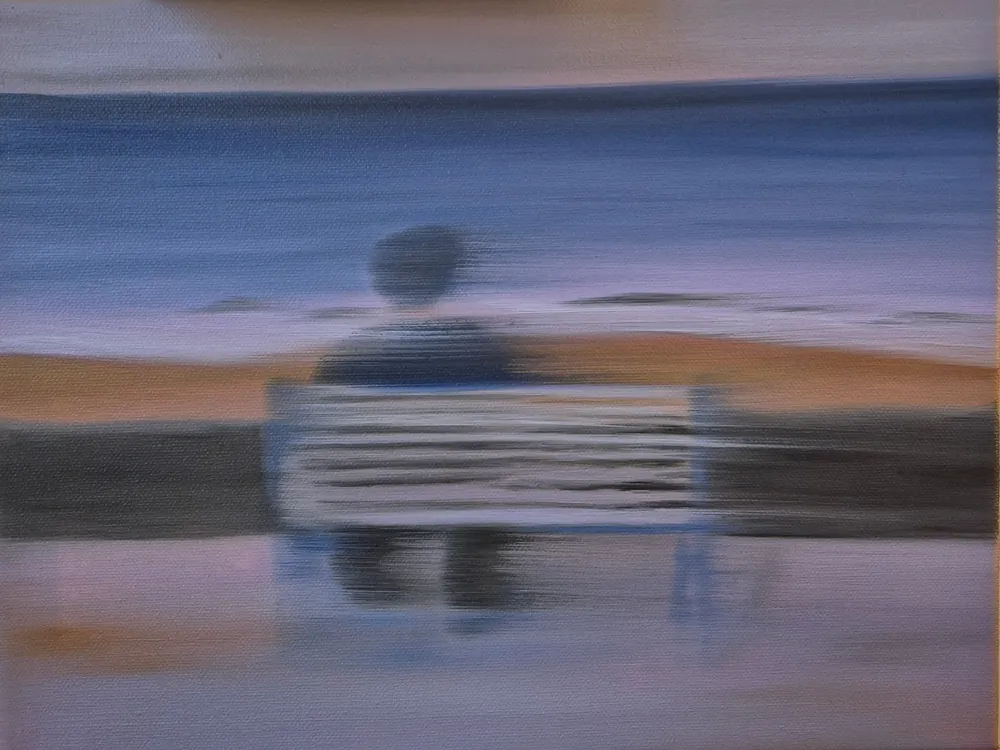 Moments Between - a blurred oil painting of a figure seated on a bench facing a blue and amber shoreline.